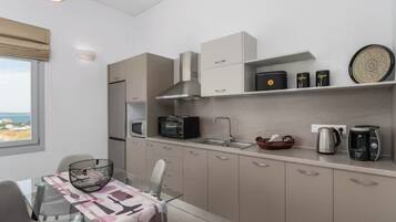 Exclusive Apartment, Garden Area | Private kitchen | Espresso maker, coffee/tea maker, electric kettle, toaster