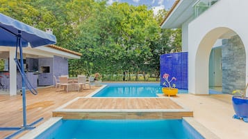 Outdoor pool, pool umbrellas, pool loungers