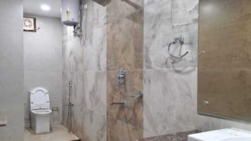 Luxury Suite, City View | Bathroom | Slippers, towels