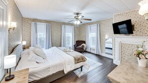 A bedroom with a bed, a chair, a television, and a fireplace. - Pet & Family Friendly! Home w/ Fenced Yard + Deck (York Haven)