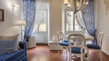 Romantic Apartment | Living area | 40-inch flat-screen TV with digital channels