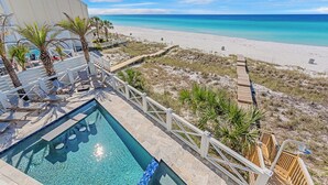 A pool area with a view of the beach and ocean. - Best of the Best! Gulf Front with Heated Pool, Private Gym, Private Elevator (Panama City Beach)