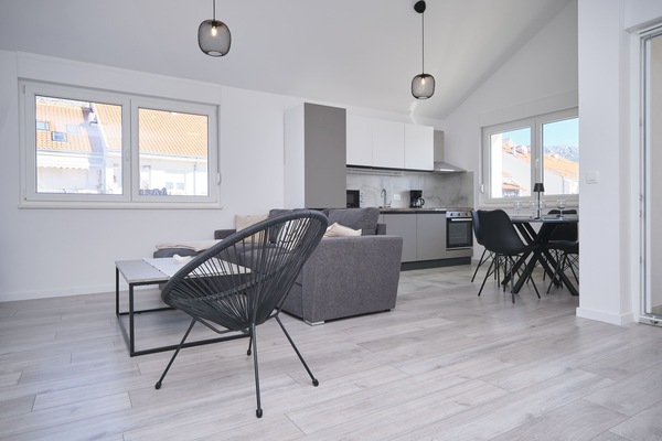 Apartment, Balcony, Bay View | Living area | 60-inch Smart TV with cable channels