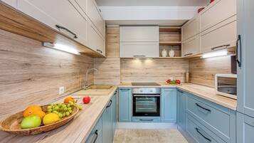 Family Apartment, Multiple Bedrooms (West Oasis With Terrace) | Private kitchen | Fridge, microwave, oven, stovetop