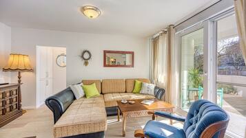 Family Apartment, Multiple Bedrooms (West Oasis With Terrace) | Living area | 21-inch flat-screen TV with cable channels, stereo