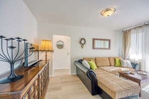 Family Apartment, Multiple Bedrooms (West Oasis With Terrace) | Living area | 21-inch flat-screen TV with cable channels, stereo