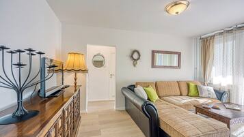 Family Apartment, Multiple Bedrooms (West Oasis With Terrace) | Living area | 21-inch flat-screen TV with cable channels, stereo