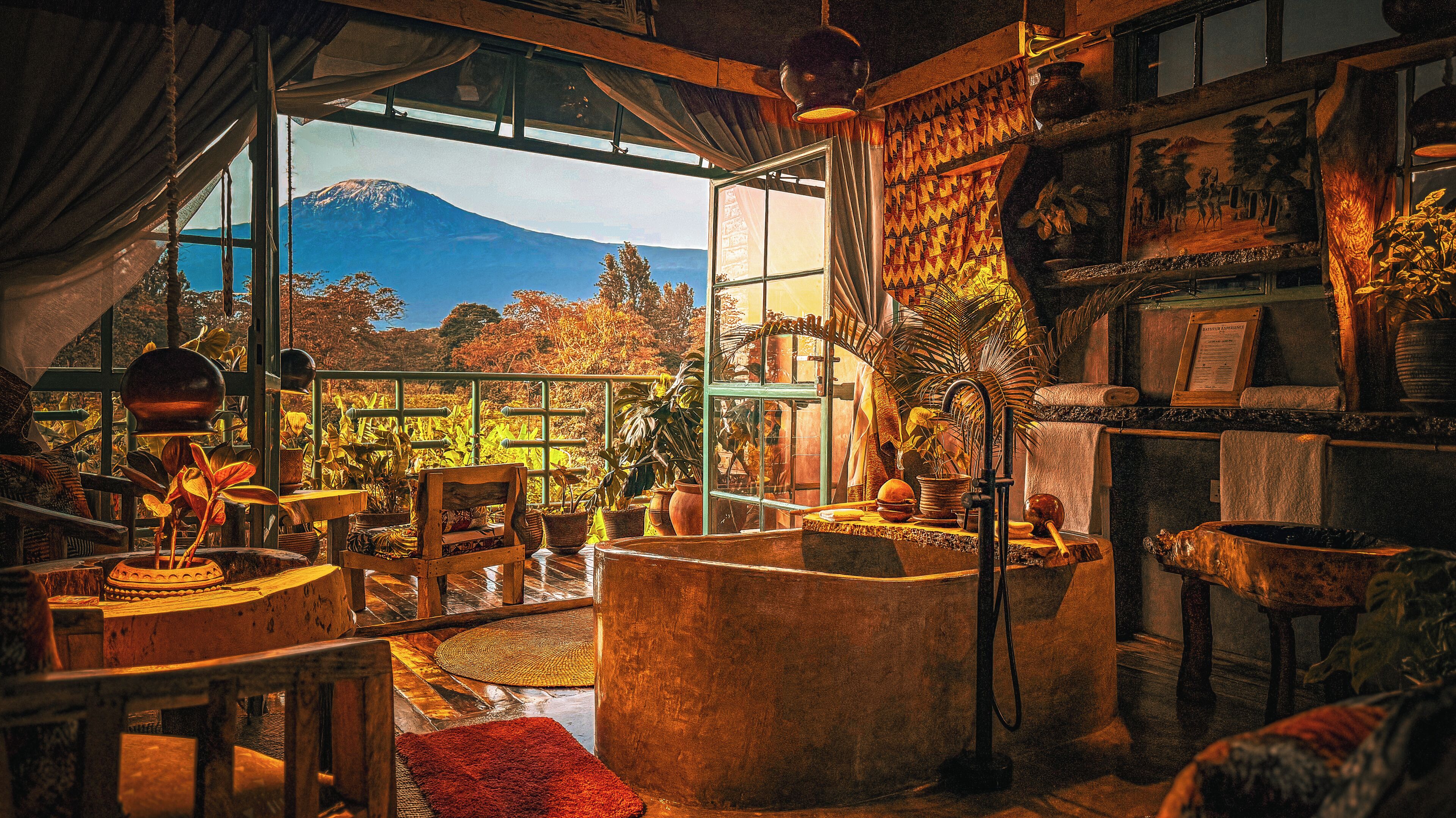 A room with a large window, wooden furniture, and various decorative items.