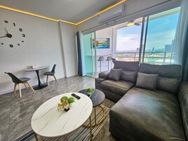 Apartment | Living area | 55-inch flat-screen TV with cable channels, Netflix, streaming services