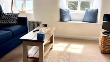Casa de campo Deluxe, 1 habitación, vistas al mar | Zona de estar | Una televisión de pantalla plana
