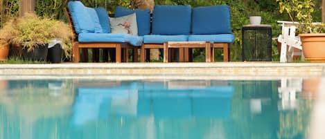 Outdoor pool, open 7:00 AM to 10:00 PM, pool umbrellas, sun loungers