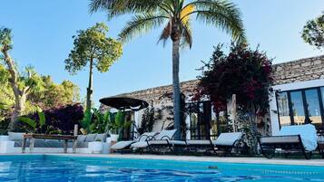 Outdoor pool, open 10:00 AM to 8:00 PM, pool umbrellas