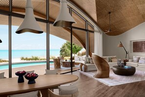 Royal Villa, 3 Bedrooms, Private Pool, Sea View | Living room | 55-inch LED TV with satellite channels, books - Nujuma, A Ritz-Carlton Reserve (Umluj)