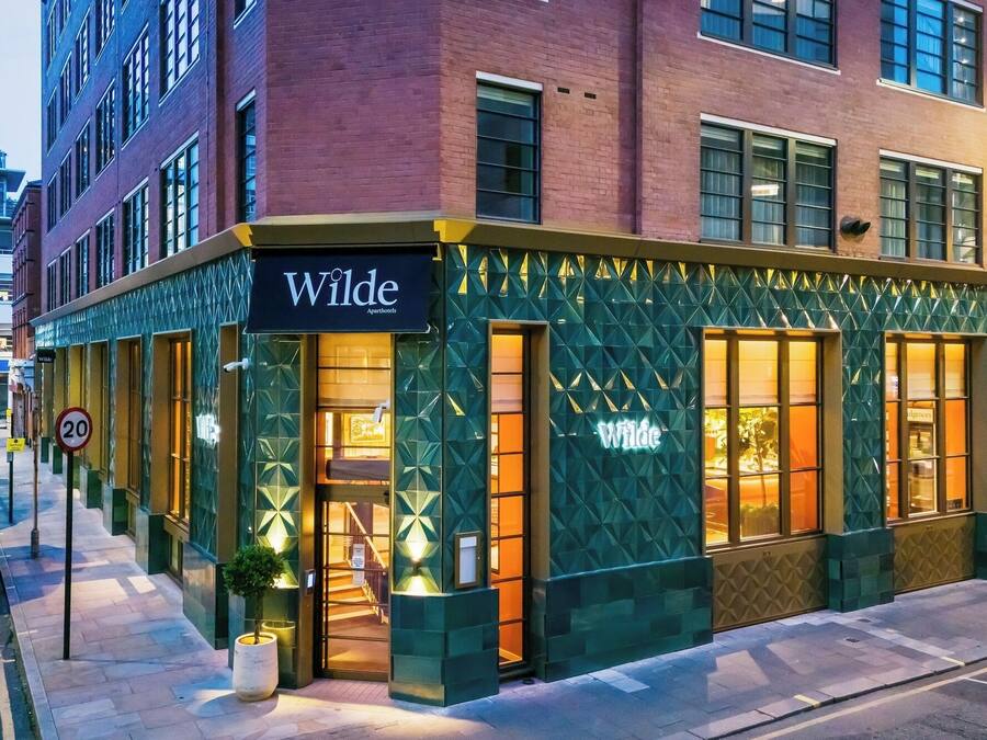 A building with a sign reading "Wilde Apartments."