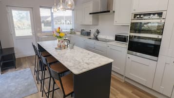 Fridge, electric kettle, toaster, cookware/dishes/utensils