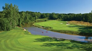 A golf course with a river, trees, and a clear sky. - Spacious 3 BDR 3 BA 2 Acre property one minute from Lake Michigan-Dog Friendly! (Coloma)