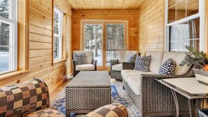 A cozy log cabin interior with a sofa, chairs, and a table. - Sunday River 5 Min!  Family / Group / Couples Retreat! (Newry)