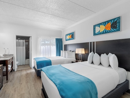 Deluxe Double Suite | Laptop workspace, iron/ironing board, free WiFi, bed sheets. OASIS BAY SUITES, Tampa, Busch Gardens, USF