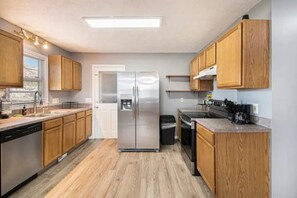 Fridge, microwave, oven, stovetop - Full home with private garage & fenced yard (Omaha)