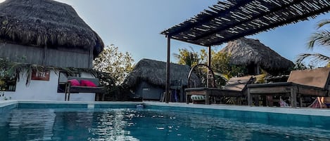 Outdoor pool, open 9:00 AM to 9:00 PM, pool umbrellas, pool loungers