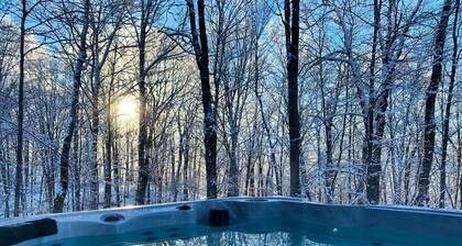 Vivez l'expĂ©rience chalet SPA au cĆur de la nature, foyer et accĂšs au lac