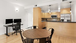 A modern kitchen with wooden cabinets, a microwave, and a stainless steel refrigerator. - 2 mins 2 Mill Ave + ASU | Pool + EV Charging + GYM (Tempe)