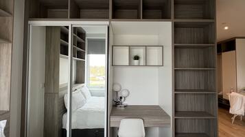 1 bedroom, desk, iron/ironing board, travel crib