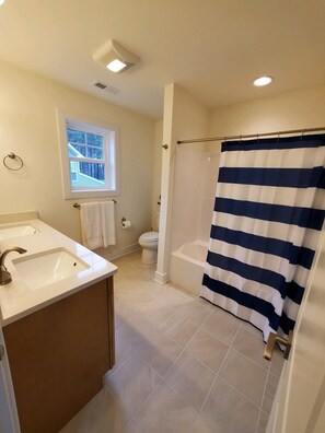 Shower, hair dryer, towels, toilet paper