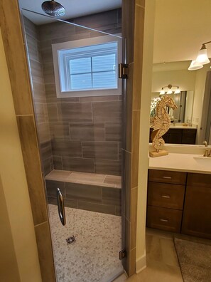 Shower, hair dryer, towels, toilet paper