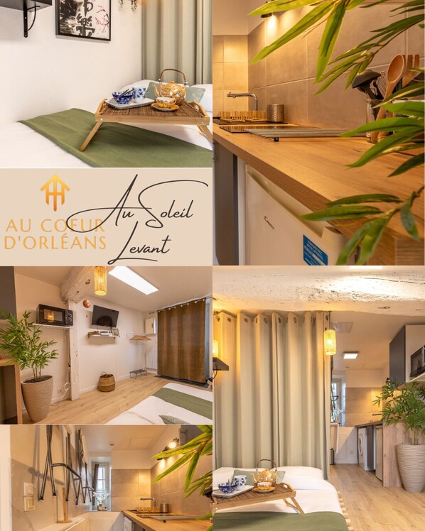 Um apartamento moderno com uma sala de estar aconchegante, cozinha com bancadas de madeira e um espaço de jantar com uma bandeja de chá e louças.