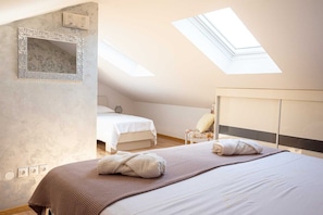 A bedroom with a skylight, a bed, a chair, and a wardrobe. - Holiday house Lucy with private pool (Žgaljići (Krk))