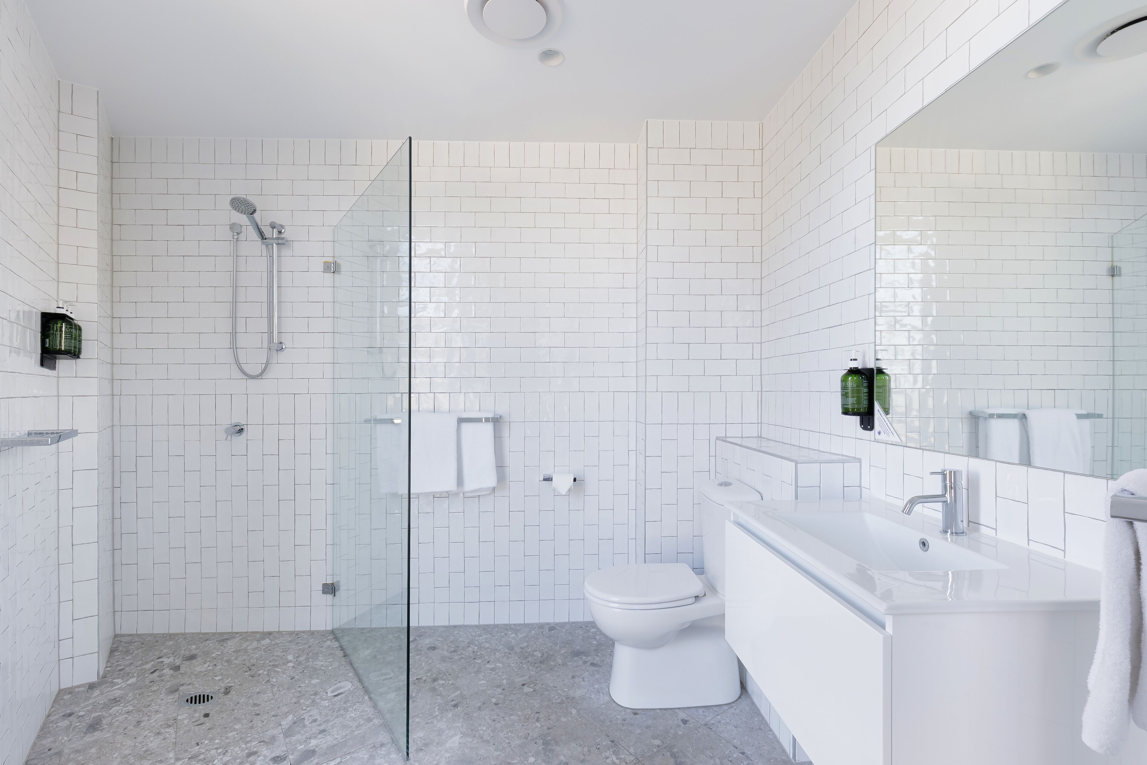 Shower, rainfall showerhead, hair dryer, towels