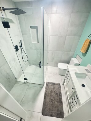 Shower, hair dryer, towels, soap