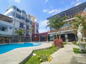 Guests can enjoy a refreshing swim in the hotel's pool surrounded by a spacious deck.