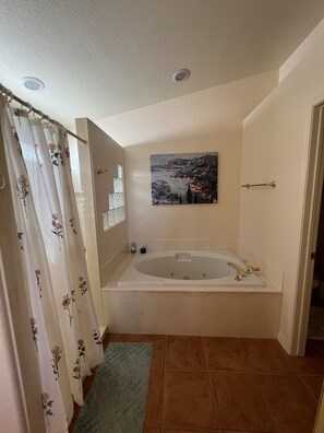 Jetted bath, hair dryer, towels, soap