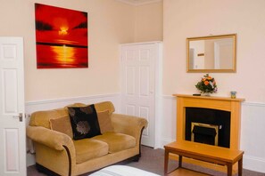 Family Apartment, Ground Floor | Living area | 38-inch flat-screen TV with digital channels - The Chadwick Holiday Flats (Skegness)