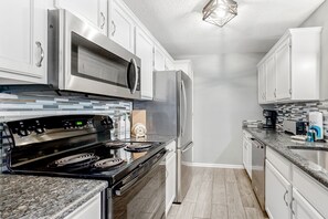 Fridge, microwave, oven, stovetop - Charming condo with water views, pool, washer/dryer, & central AC (Myrtle Beach)