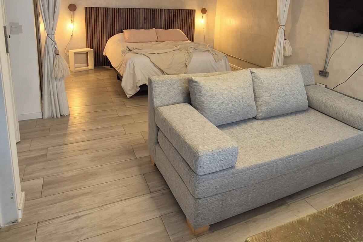 Deluxe Apartment, City View | Living area | 35-inch flat-screen TV with digital channels