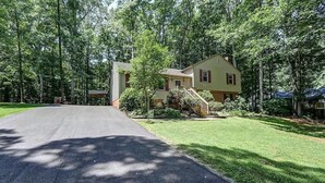 A two-story house with a front yard and a driveway. - LU Commencement Rental - Easy 15 minute drive to LU campus. (Forest)