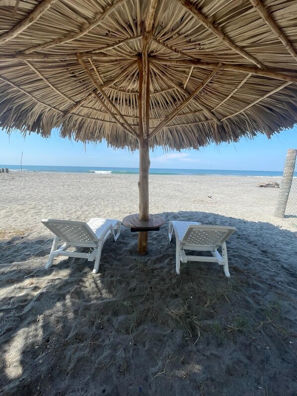 On the beach, sun loungers