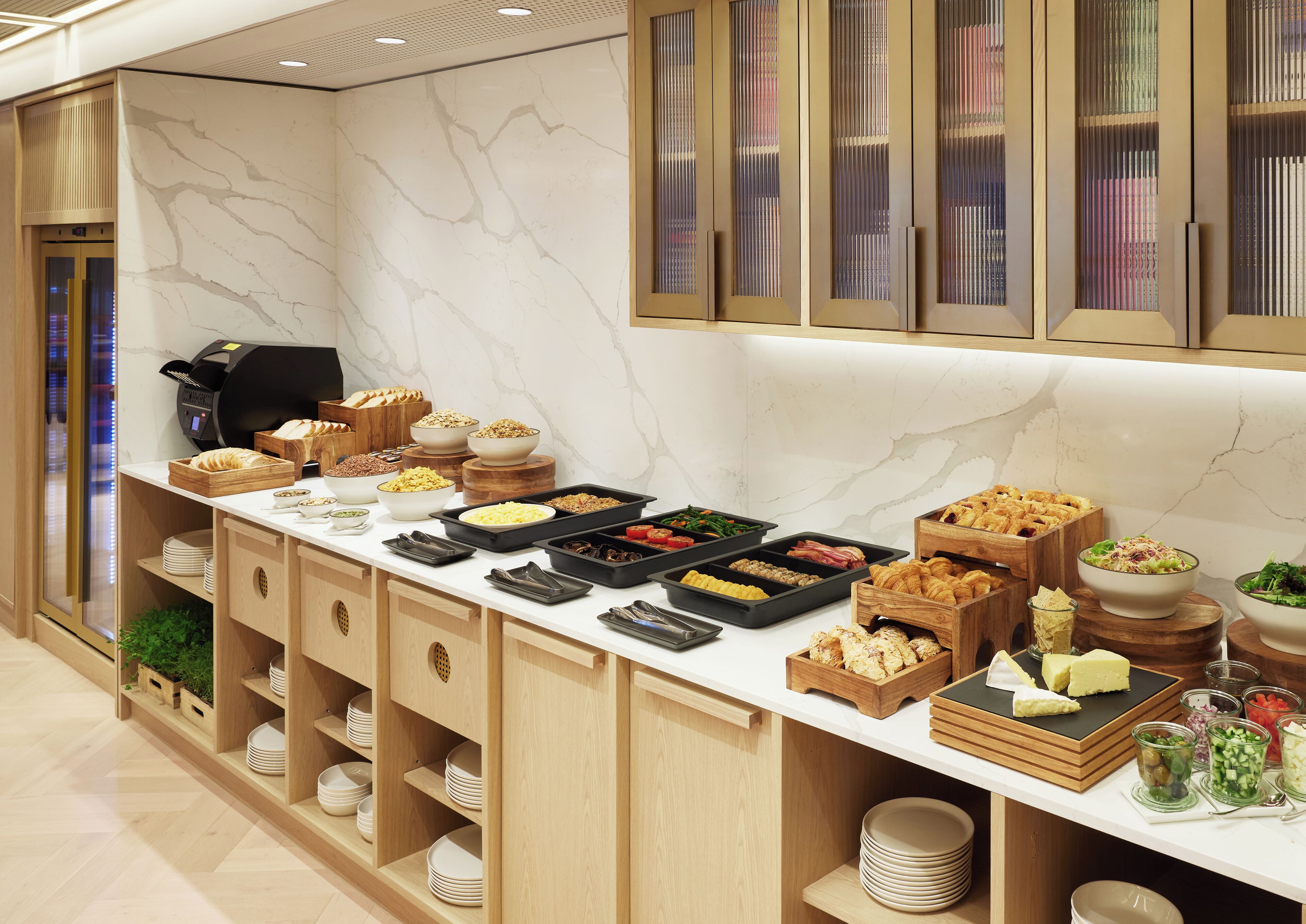 A buffet setup with various food items and serving dishes.