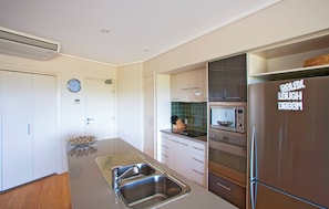 Fridge, microwave, oven, stovetop - Beach Karma: Three-Bedroom Beachside Escape with Heated Pool in Agnes Water (Agnes Water)