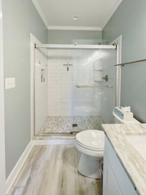 Shower, hair dryer, towels, soap