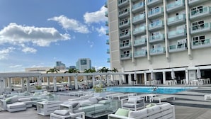 A rooftop pool area with white lounge chairs and a swimming pool. - Last Minute Spacial! Oceanview's on 31st Flr (Honolulu)