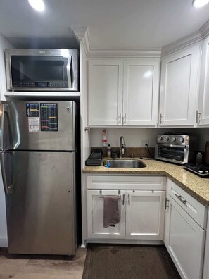 Fridge, microwave, coffee/tea maker, toaster