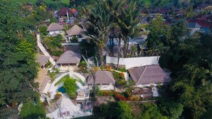 An aerial view of a residential area with houses, a swimming pool, and lush greenery. - Kembali On The River by Balipras (Cepaka)