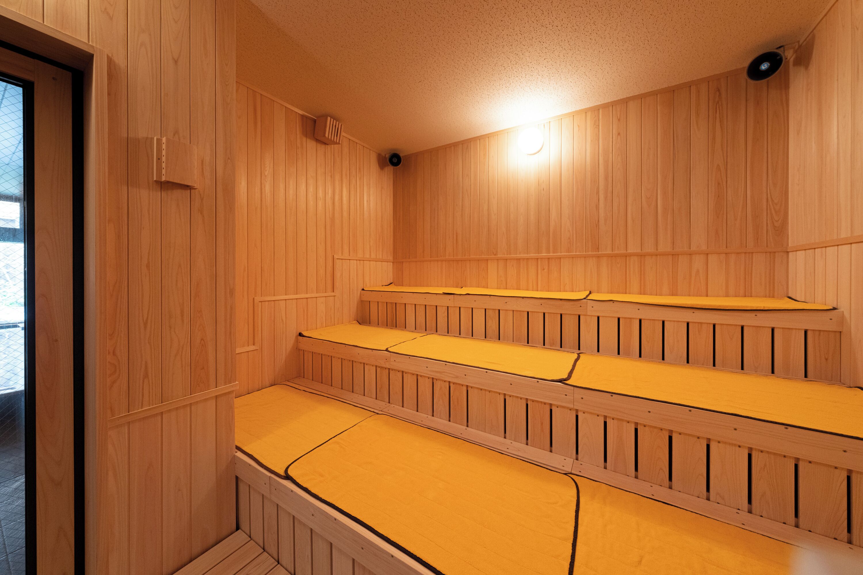 A sauna with wooden walls and benches.