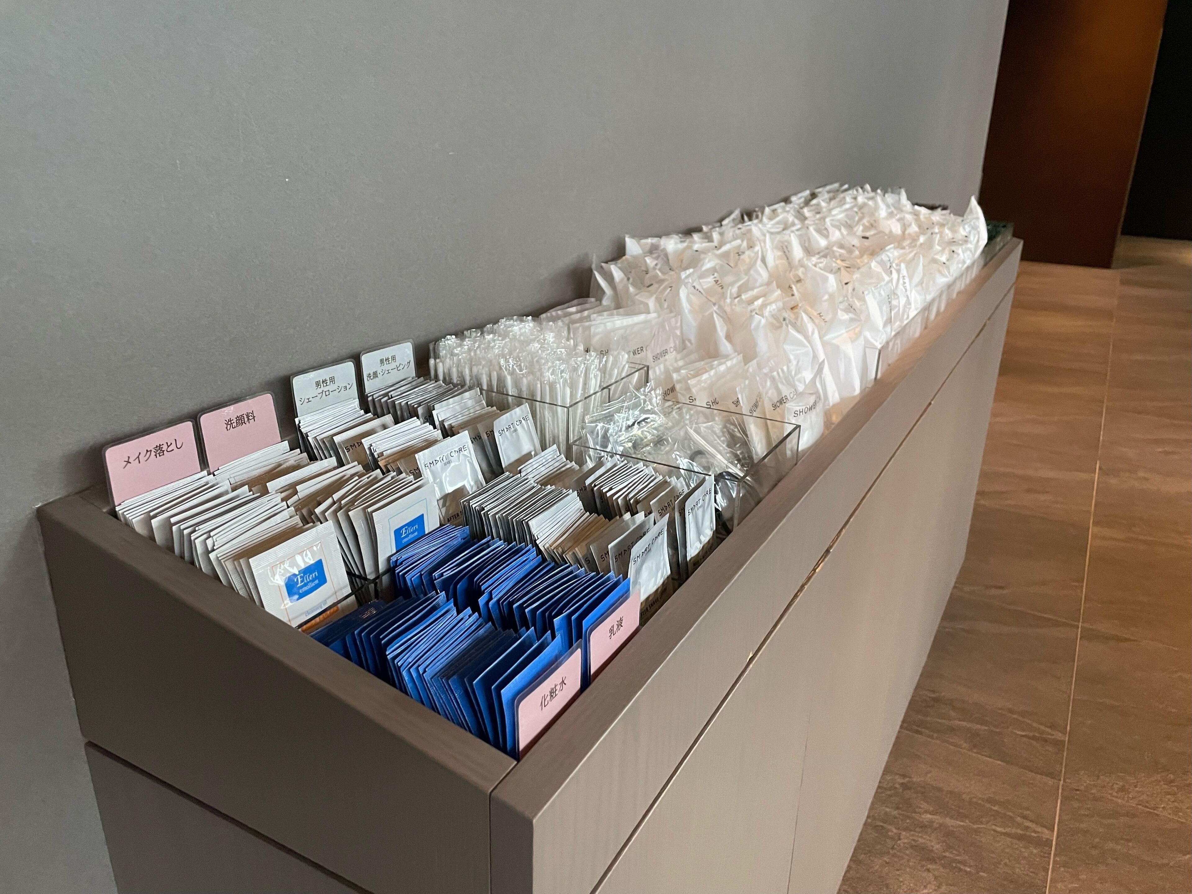 A storage unit with neatly organized folders and labeled cards, likely for guest use.