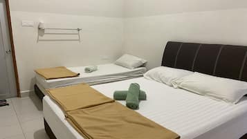 Laptop workspace, bed sheets