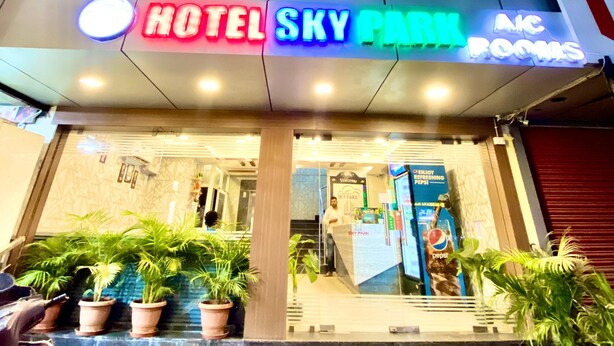 The entrance to Hotel Sky Park with a sign indicating AIC Rooms. - Hotel Sky Park - Airport Zone (Hyderabad)